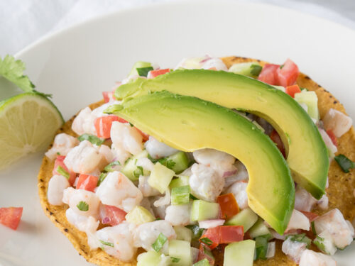 shrimp served with avocado on top