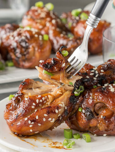 A close up of a plate of food, with Chicken and fork