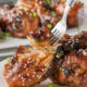 A close up of a plate of food, with Chicken and fork