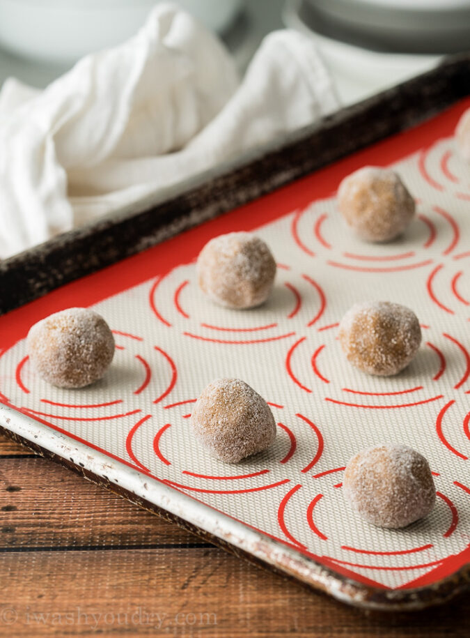 Arrange the molasses ginger cookies about 2 inches apart on a lined baking sheet.