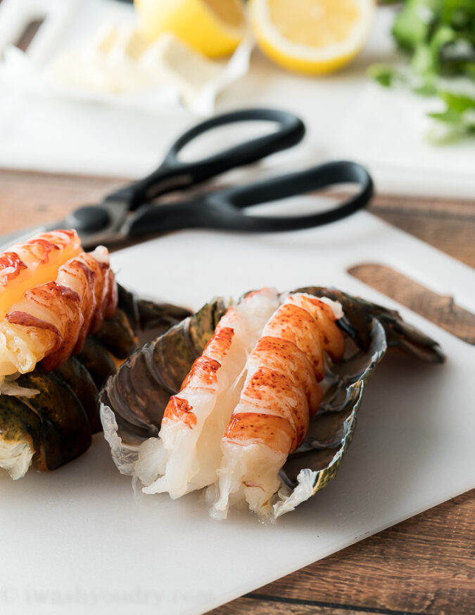 Gently peel back the lobster tail shell to reveal the meat.