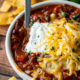 A plate of chili on a table