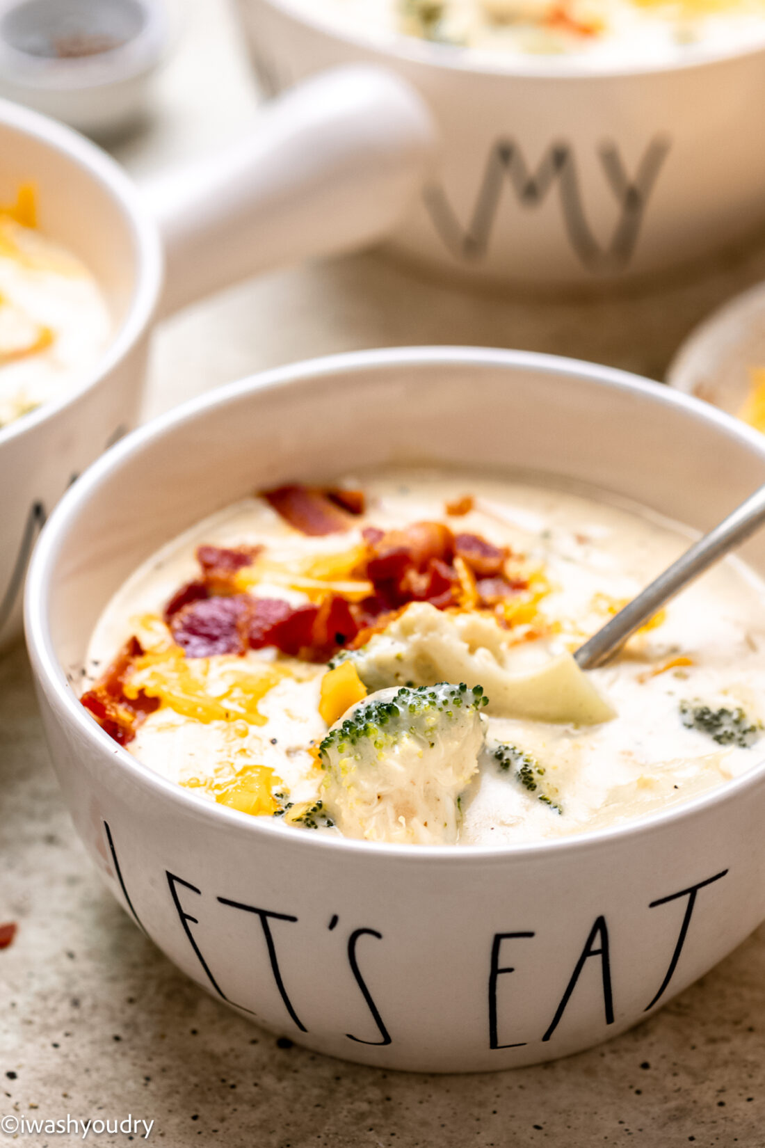 soup bowl filled with broccoli cheese and bacon soup.