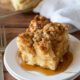 YUM! This super easy French Toast Casserole recipe is soaked overnight in an egg mixture, topped with a brown sugar crumble, then baked to perfection!