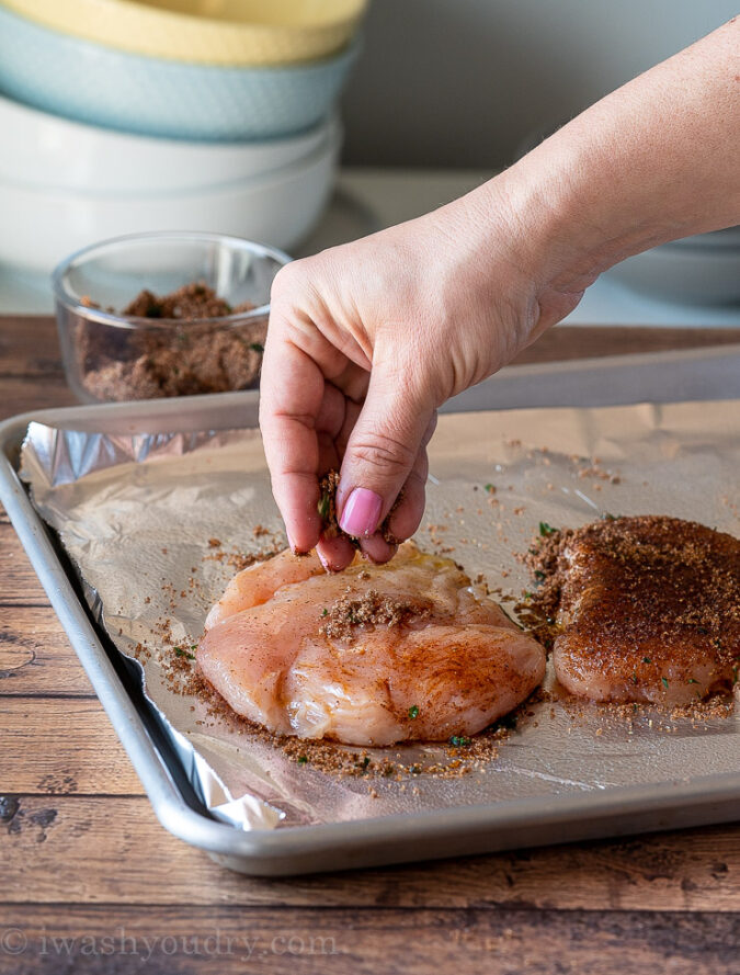 Season chicken breast with a simple blend of spices before baking in oven.