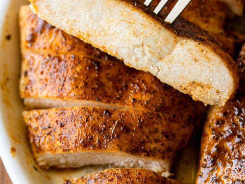 Slice of juicy chicken breast on a fork