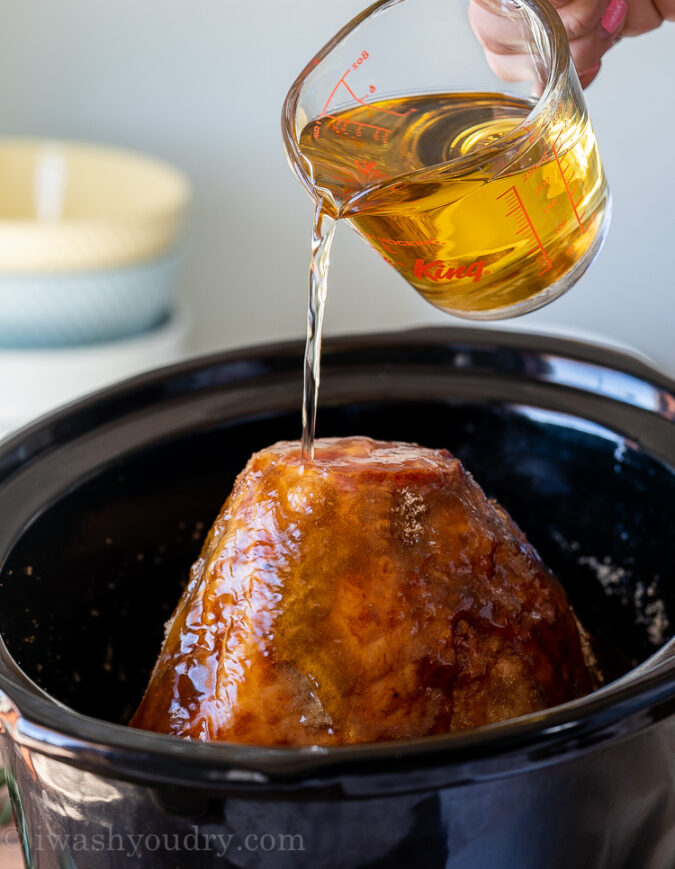 Pour apple cider over the top of the ham and cook in the crock pot.