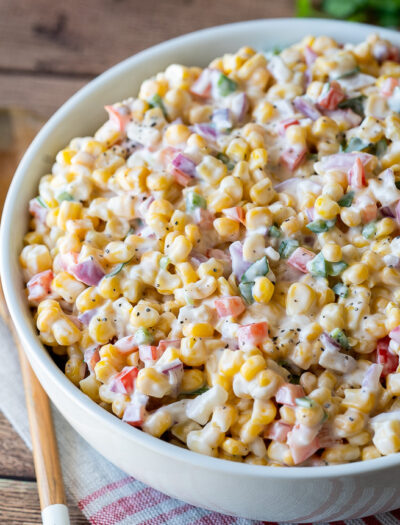 Serve this creamy corn salad at all your summer pot lucks and bbq's and watch it disappear so fast!