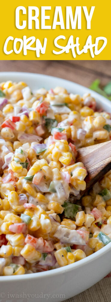 This Creamy Corn Salad Recipe is a quick and easy side dish that's filled with crisp corn kernels that pop in a creamy sauce; perfect for summer potlucks and bbq's!