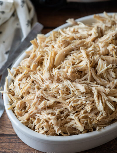 Deliciously seasoned shredded chicken breast made right in the slow cooker! So tender and juicy!