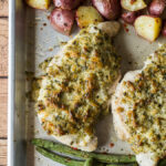 A plate of food, with Chicken, potatoes and green beans