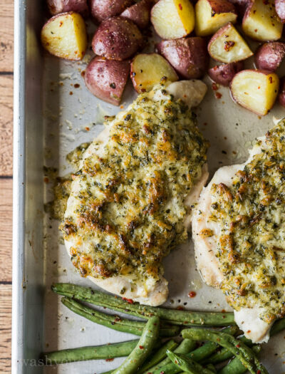 A plate of food, with Chicken, potatoes and green beans