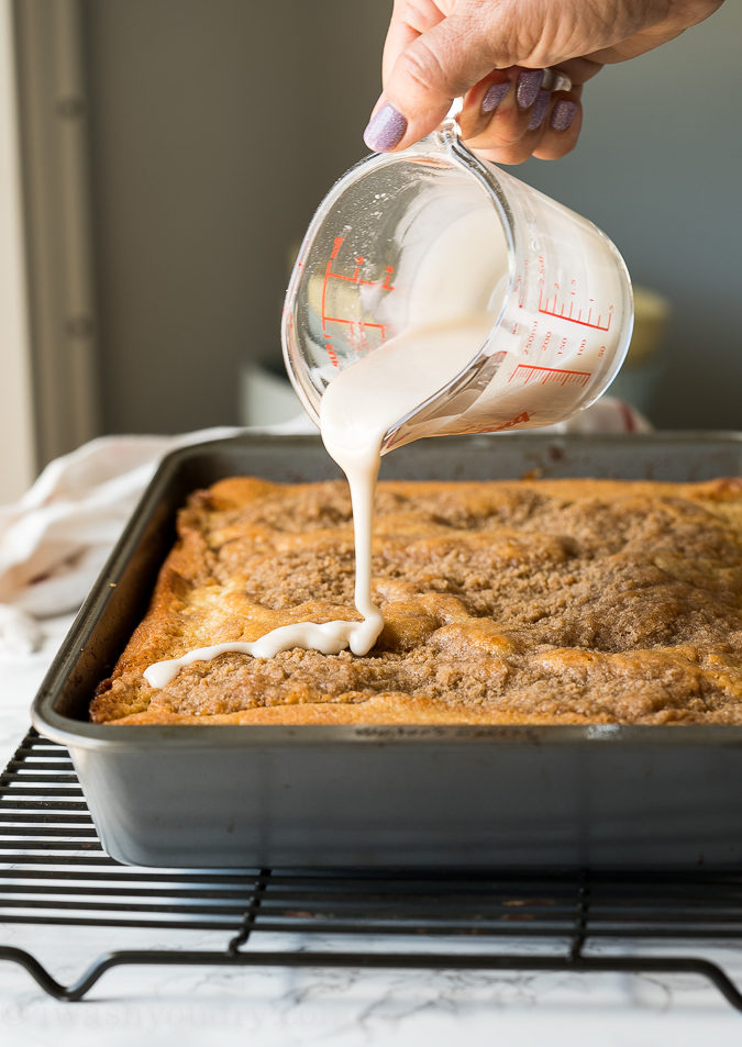 Drizzle the top of the crumb cake with a sweet icing.