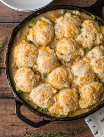 A pan on a table, with Biscuits and Chicken