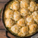 A pan on a table, with Biscuits and Chicken