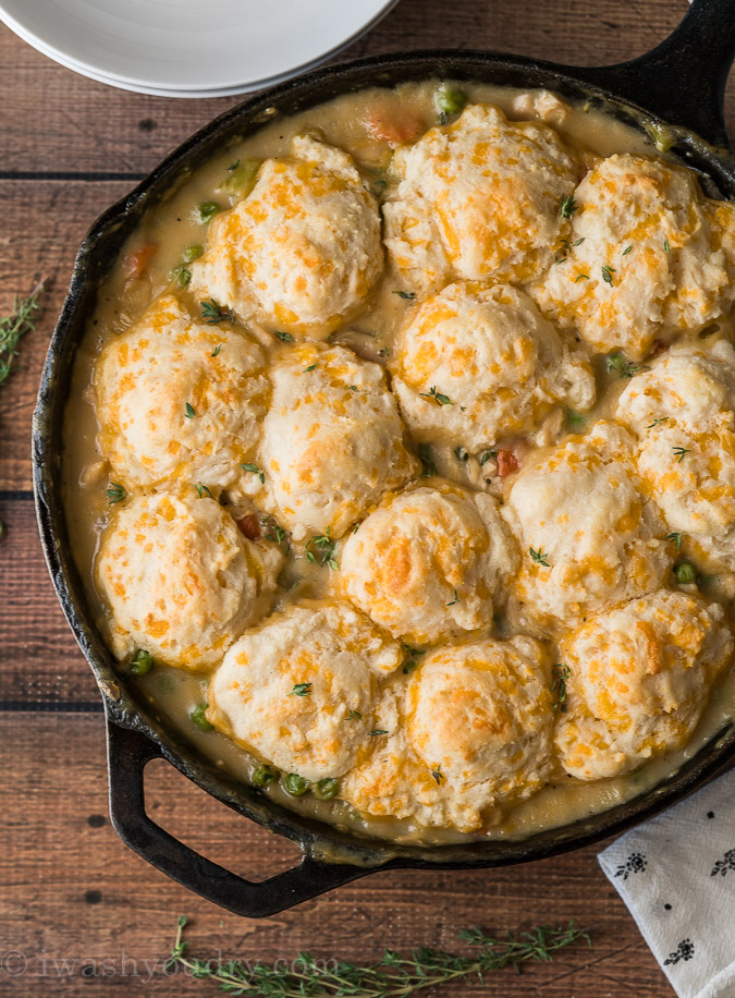 A pan on a table, with Biscuits and Chicken