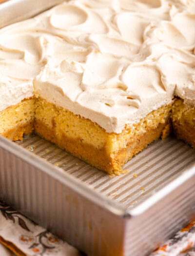 pumpkin magic cake in pan with frosting on top