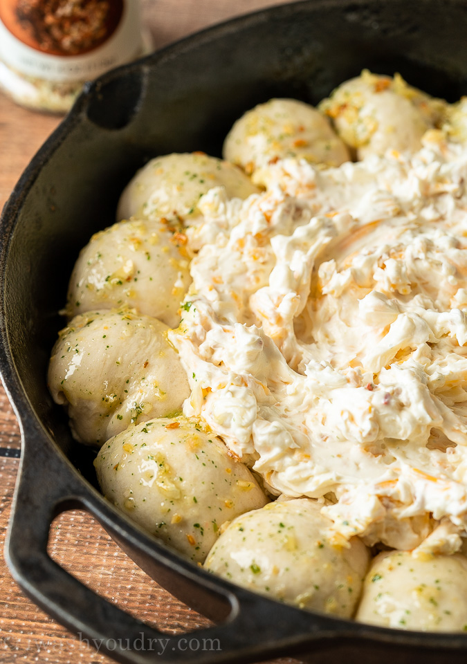 Brush the outer biscuits with butter and seasoning before baking.