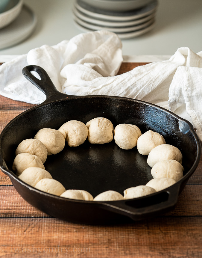 Line the outer edge of the skillet with refrigerator biscuits.