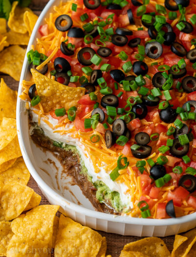 A layered dip on plate of food