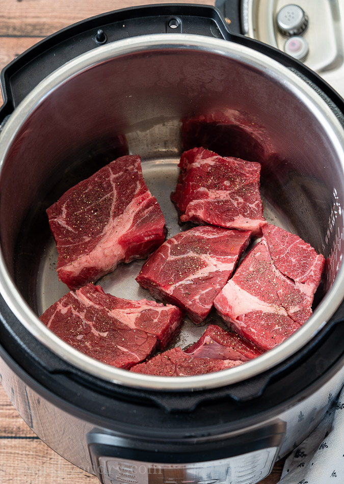 Cuts of beef being seared in the Instant Pot