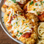 Recipe For Chicken Parmesan made in the Air Fryer and served over pasta!