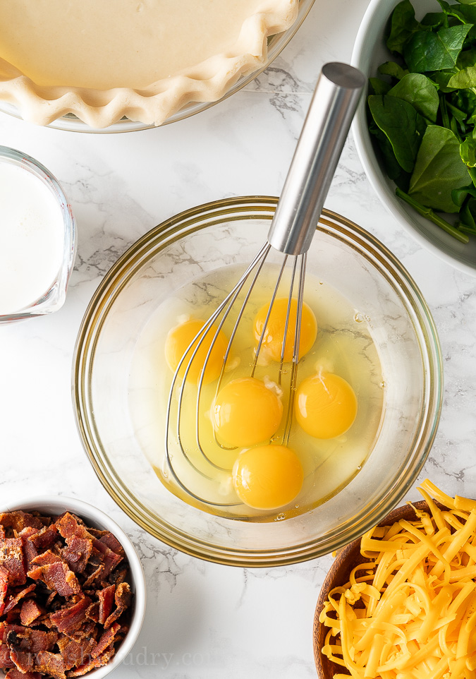 Basic Quiche Ingredients laid out on marble board