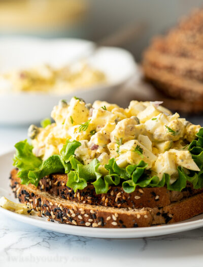 A close up of a plate of food, with Egg and Salad