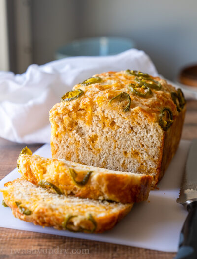 This quick (no yeast required) Cheesy Jalapeño Beer Bread Recipe is soft and tender with the perfect blend of cheddar throughout!