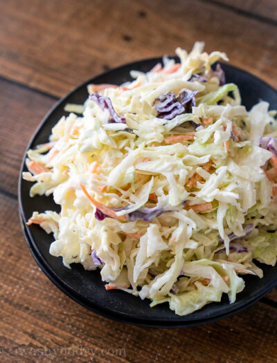 Black plate filled with creamy Coleslaw recipe.