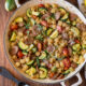 Chicken sausages, zucchini, tomatoes and pasta in a large skillet