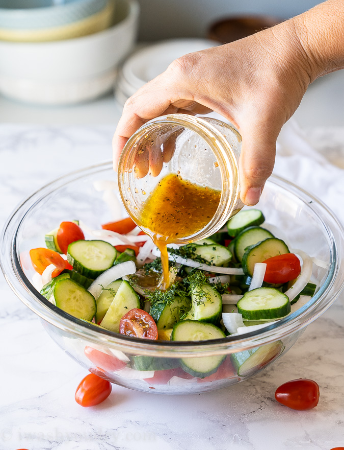 Pour simple vinaigrette over the cucumber salad