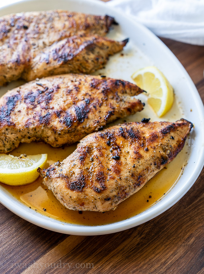 Resting grilled chicken on platter