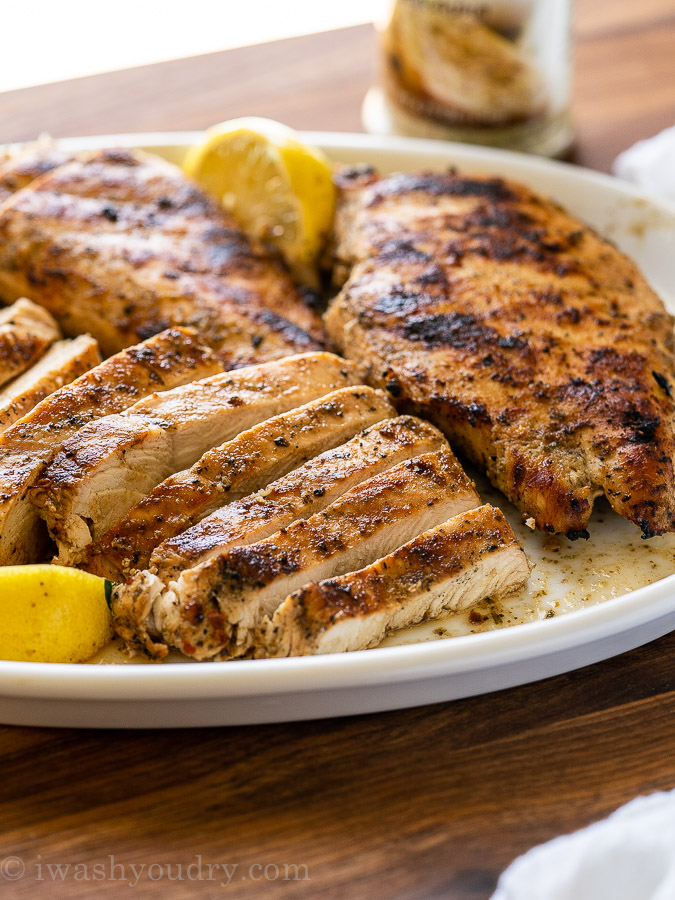 Juicy Grilled Chicken cut into slices on a white plate