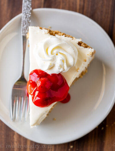 A piece of cake on a plate, with Cheesecake