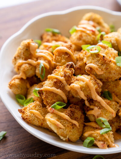 Crispy breaded chicken topped with bang bang sauce and green onions.