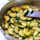 Sautéed Zucchini in a skillet with red pepper flakes.