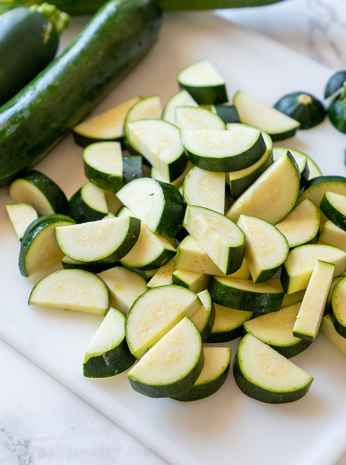 Cut zucchini into half moon shapes.