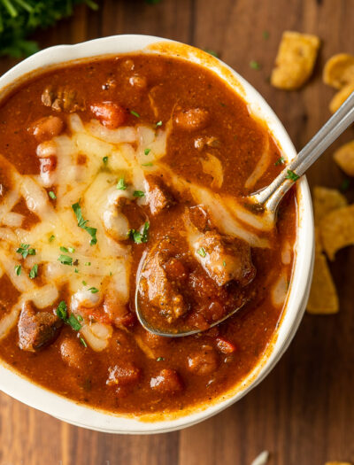 Beef chili in a bowl with spoon