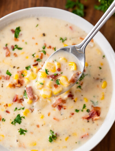 spoonful of corn chowder in bowl