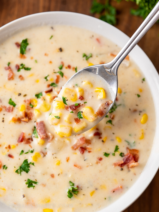 spoonful of corn chowder in bowl