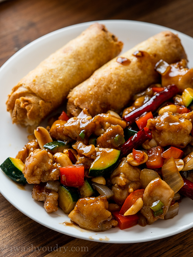 kung pao chicken on plate with vegetables