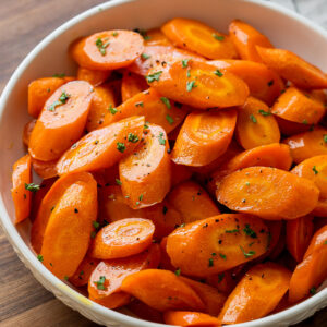 white bowl full of sliced roasted carrots