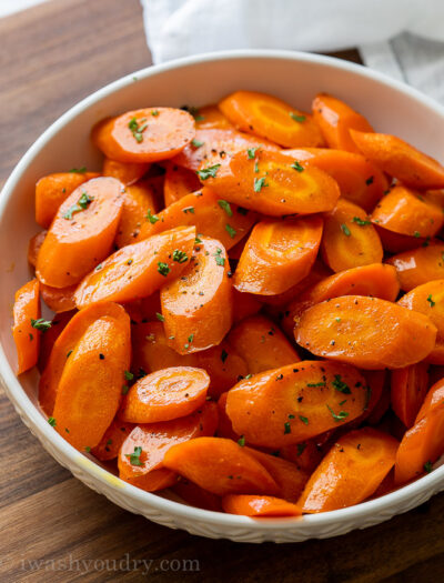 white bowl full of sliced roasted carrots