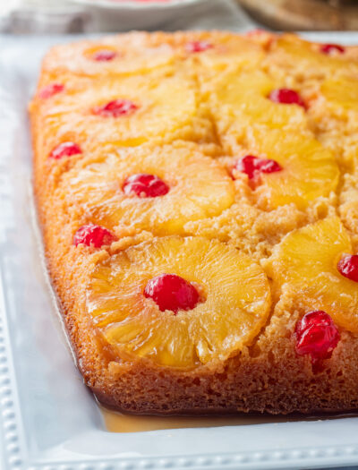 Baked cake on white platter.