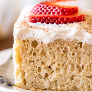 Tres Leches Cake recipe with whipped cream and strawberries