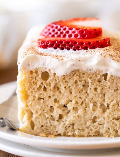 Tres Leches Cake recipe with whipped cream and strawberries