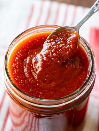 homemade honey bbq sauce in jar with spoon