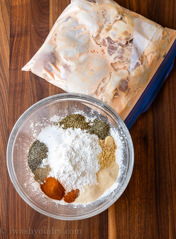 Marinating chicken pieces with breading ingredients