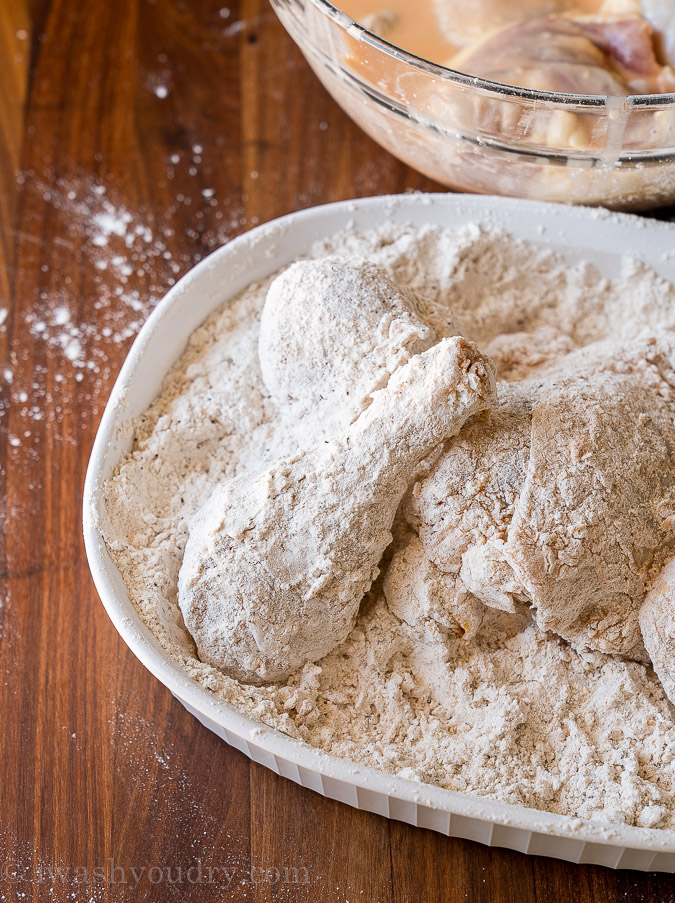 dredge chicken pieces in flour